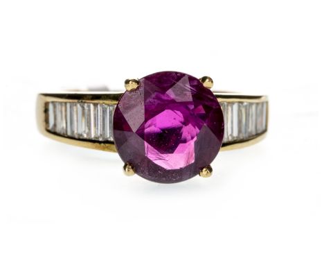 RUBY AND DIAMOND RING, the round ruby of approximately 3.26 carats flanked by baguette cut diamonds totalling approximately 0