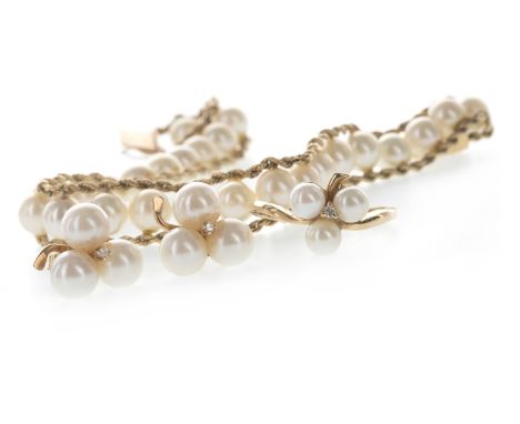 FAUX PEARL BRACELET, formed by spherical faux pearls, within a ropetwist border, 18.5cm long, marked 14K and 585, along with 