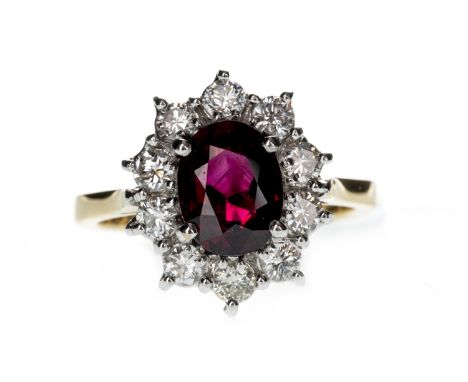 RUBY AND DIAMOND CLUSTER RING, set with an oval ruby of approximately 2.03 carats, within a halo of round brilliant cut diamo