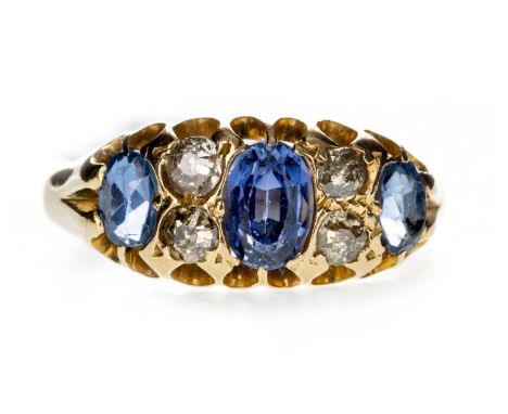 SAPPHIRE AND DIAMOND RING, set with three oval sapphires interspaced by pairs of old cut diamonds totalling approximately 0.2