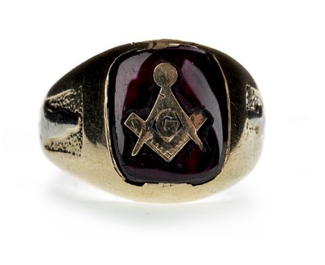 RED GEM SET MASONIC RING, the cushion shaped gem with sunken masonic emblem, unmarked, size J 1/2, 6.3g