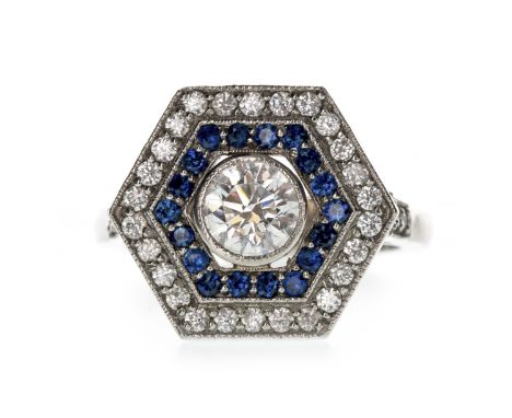 SAPPHIRE AND DIAMOND RING, set with a round brilliant cut diamond of approximately 0.80 carats, within a halo of round sapphi