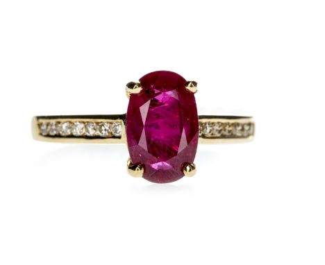 RUBY AND DIAMOND RING, set with an oval ruby of approximately 2.35 carats flanked by round brilliant cut diamonds totalling a