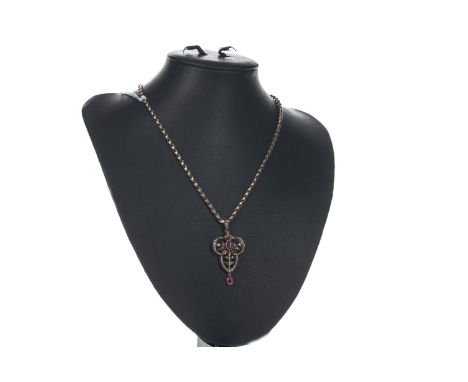 PINK GEM SET AND SEED PEARL HOLBEIN, of openwork sinuous form, set with two oval pink gems and seed pearls, marked 9CT, on a 