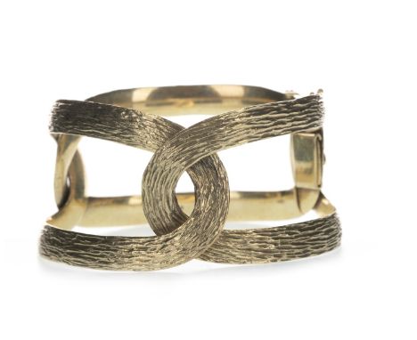 TEXTURED BANGLE, formed by two interlocking sections, 32mm wide, marked 9 and 375, 47g