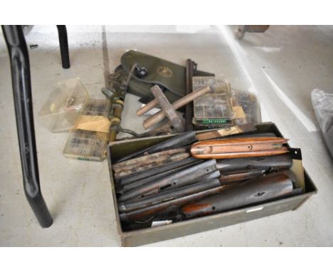 A selection of gun locks and screws also tools and cartridge loader