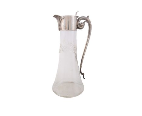  A silver mounted glass claret jug by Walker  &  Hall,   Sheffield 1914, the flat cover with an open work shell thumb piece, 