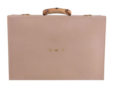  An Edwardian tan pigskin suitcase,   gilt stamped J.W-S., with brown moire silk lined interior, the toilet accessory compart