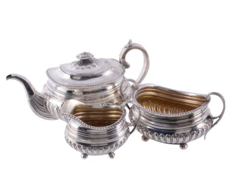 A late George III Scottish silver oblong baluster three piece tea service,   mark of Mitchell  &  Russell over-striking that