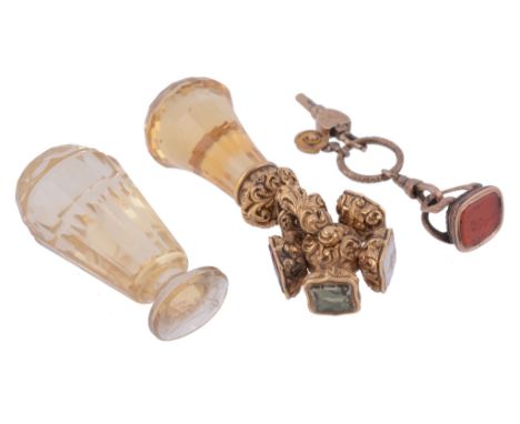  A Victorian citrine swivel desk seal,   the scroll foliate chased mount with five seals, the differing matrices carved with 