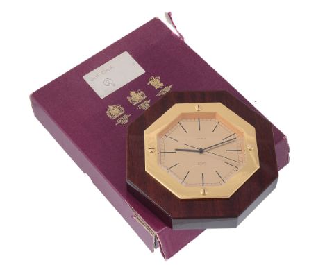  Asprey, an octagonal wall clock,   quartz movement, no. 1851985, gold dial, baton markers, sword hands, centre seconds hand,