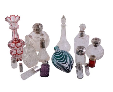  A collection of glass scent bottles some silver mounted,   including: a Nailsea type green and opaque flask; a Bohemian ruby