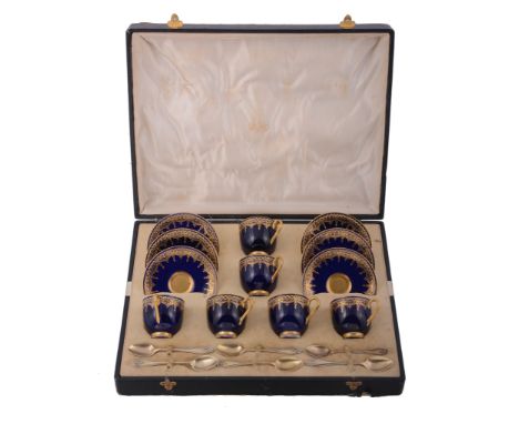  A set of six Royal Worcester bone china coffee cups and saucers,   puce printed marks, pattern C.900; and a set of six silve