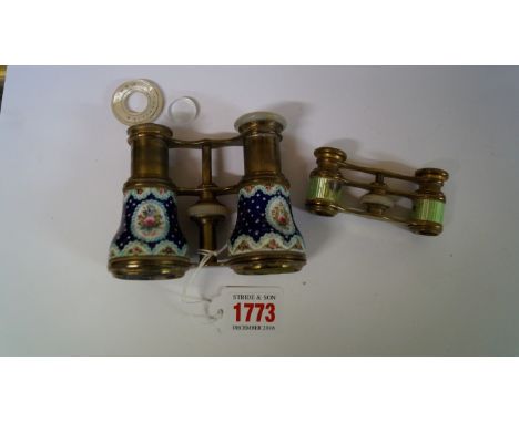 A pair of French brass and enamel opera glasses; together with another further smaller pair, (s.d. to latter). 