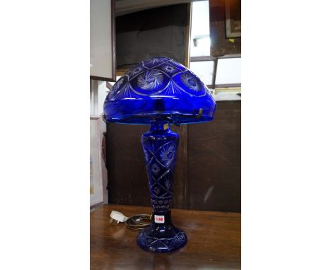 A Bohemian blue overlaid glass table lamp and shade, 55.5cm high.