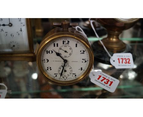 An antique Zenith brass alarm clock, the dial inscribed J W Benson, London', height including handle 9.5cm.