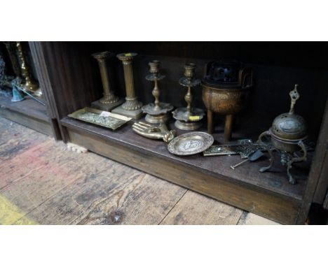 A small quantity of brassware, to include two pairs of candlesticks; and a twin handled tripod censer. 