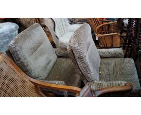 A pair of vintage upholstered occasional swivel armchairs. 