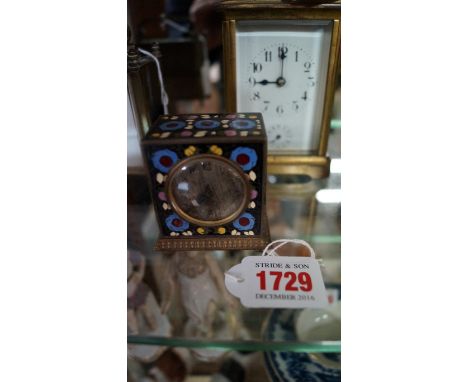 An early 20th century cloisonne enamel timepiece, with silvered circular dial, 6.2cm high. 