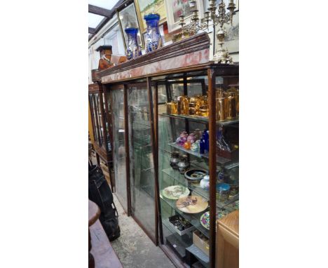 An early 20th century large mahogany and mirrored glass shop display cabinet, 166cm high x 215.5cm wide. Condition Report: Wi