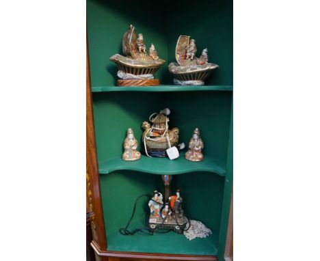 A collection of six Japanese satsuma pottery figural lamp bases, largest excluding fitting 29.5cm. 