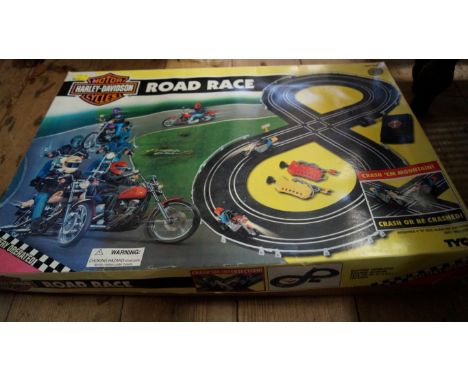 A Marx Match-Play golf game, boxed; together with a Tyco Harley Davidson Road Race set, boxed. 