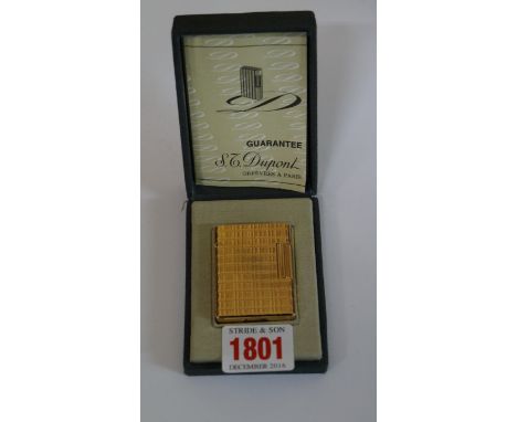 A Dupont gilt lighter, in fitted case with instruction booklet.