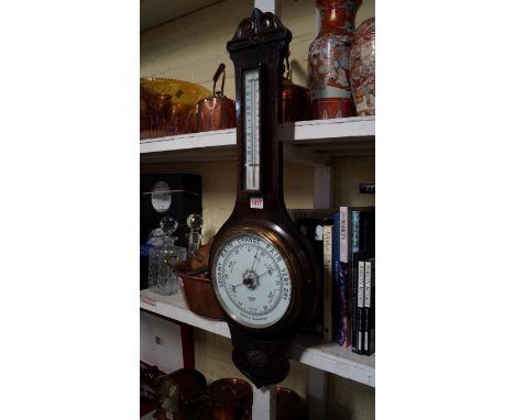 An oak aneroid wheel barometer. 