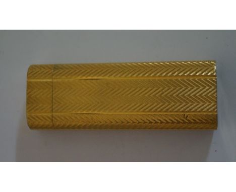 A Cartier engine turned lighter, with herringbone pattern, 7cm long. 