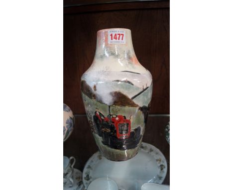 A Cobridge stoneware vase, decorated with a rural scene of a tractor in a landscape, 25.5cm high. 