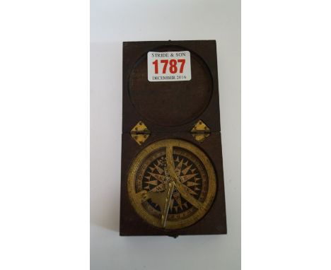 A Georgian mahogany cased brass folding pocket sundial and compass, 6.9cm wide. 