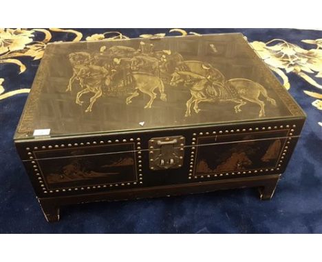20TH CENTURY CHINESE LEATHER BOUND TRUNK, the hinged top painted with figures on horseback, 77cm wide