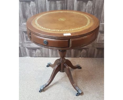 MAHOGANY REPRODUCTION DRUM TOP OCCASIONAL TABLE, the top inset tooled leather panel, with drawer