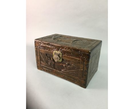 TWO 20TH CENTURY CHINESE CARVED WOOD CABINETS, decorated with figs in architectural scenes