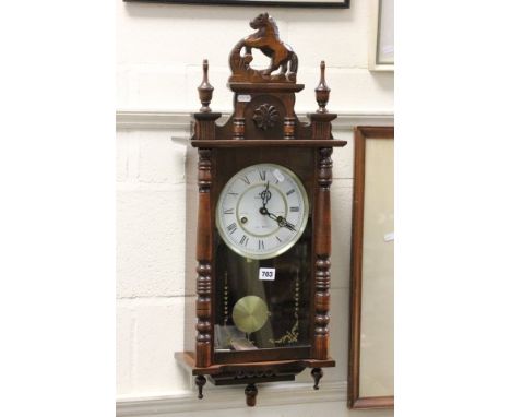 Contemporary Vienna Style hanging Wall Clock with horse design to finial and face marked Commodor 31 day