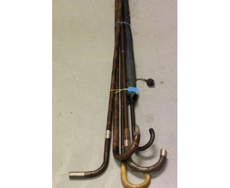 Two Silver Banded Walking Sticks, Silver Plated Tipped Walking Stick, Horn Handled Walking Stick and a Vintage Umbrella