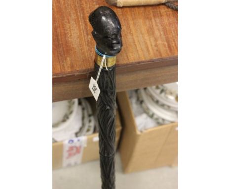 Heavy Ebonised Walking Stick with African's Head with Glass Eyes