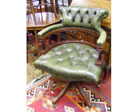 A button backed office armchair.