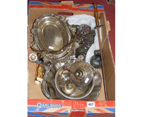 A box of vintage silver-plated and metal items.