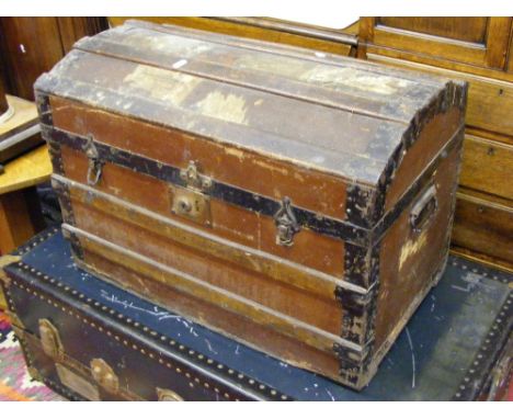 A dome topped carriage trunk.