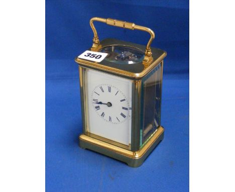 A brass cased carriage clock.