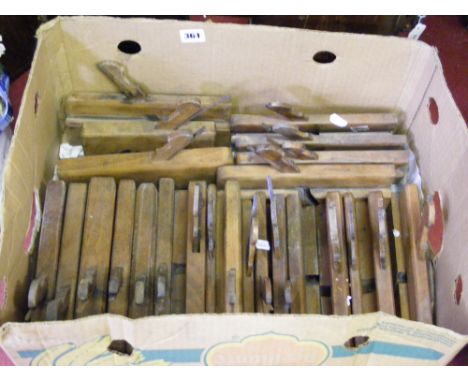 A box of approximately 25 vintage moulding planes.  
