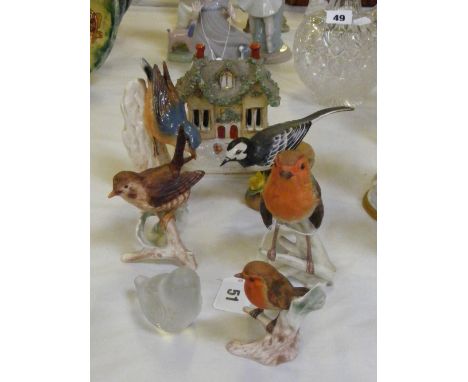 Four Goebel figures of birds comprising a robin, wren, nuthatch and another robin, plus a Baccarat glass figure of a bird, a 