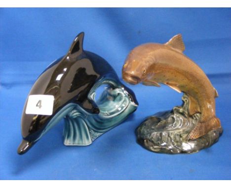 A Beswick figure of a trout, numbered 1032, together with a Poole figure of a dolphin.