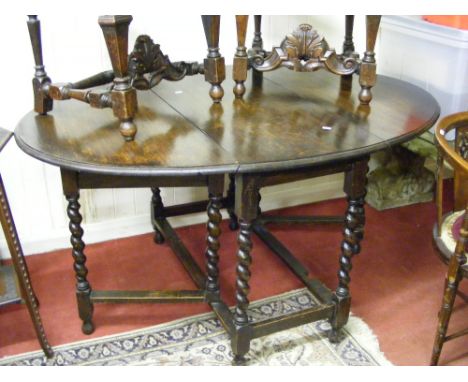 An antique oak barley twist gate leg table.