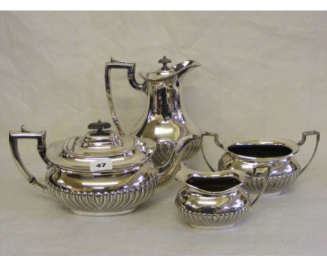 A four piece silver-plated tea and coffee service comprising coffee pot, teapot, sugar bowl and milk jug, all having half gad