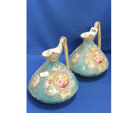 A pair of Continental vases, each having a looped handles and with overlaid and hand painted floral decoration on a light gre