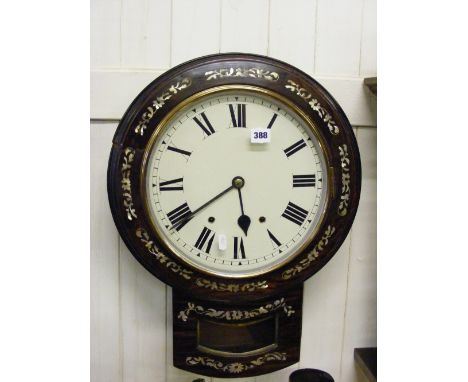 An Edwardian rosewood drop dial wall clock with floral mother of pearl inlay to case.