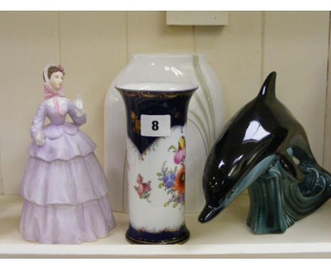 A collection of china items, to include a Dresden vase with floral decoration, a Poole figure of a dolphin, a Royal Worcester