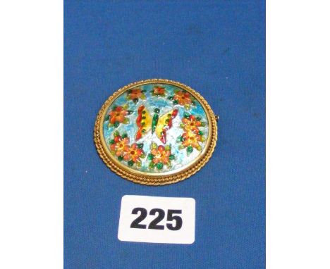 Limoges enamel.   An attractive circular brooch with a central metal plaque decorated with enamel flowers and a butterfly hel